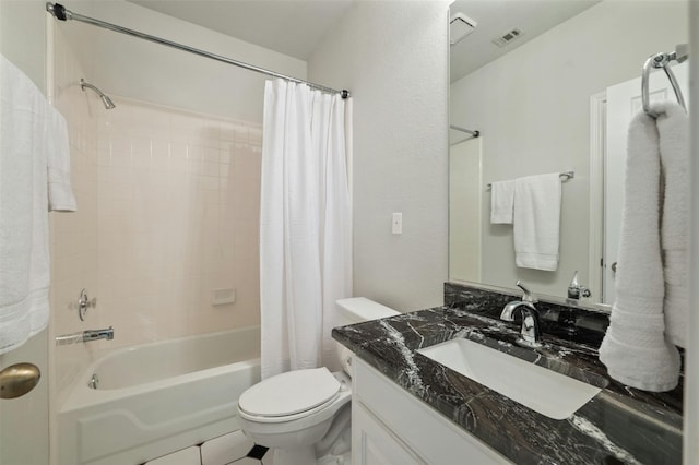 full bathroom featuring toilet, tile patterned flooring, vanity, and shower / tub combo