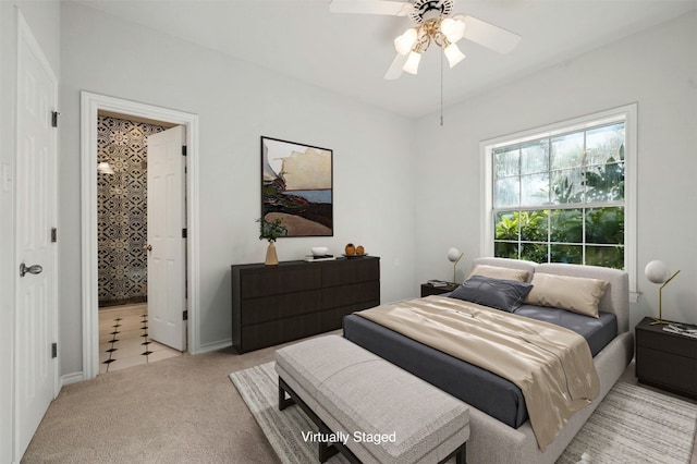 carpeted bedroom featuring ceiling fan