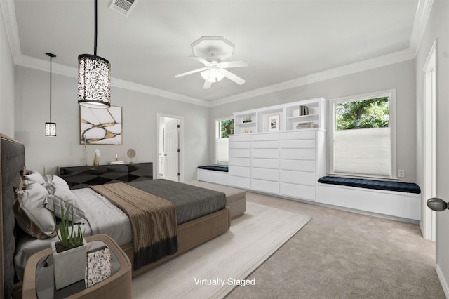 bedroom featuring ornamental molding, light carpet, and ceiling fan