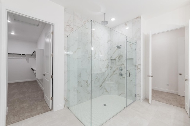 bathroom featuring a shower with door