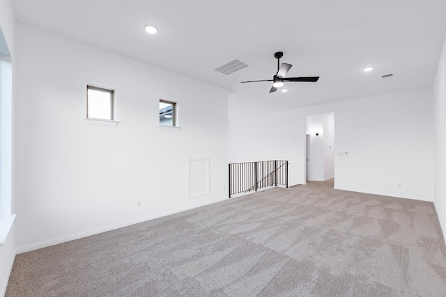 carpeted empty room with ceiling fan