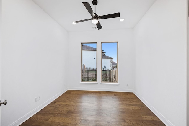 unfurnished room featuring ceiling fan and dark hardwood / wood-style flooring