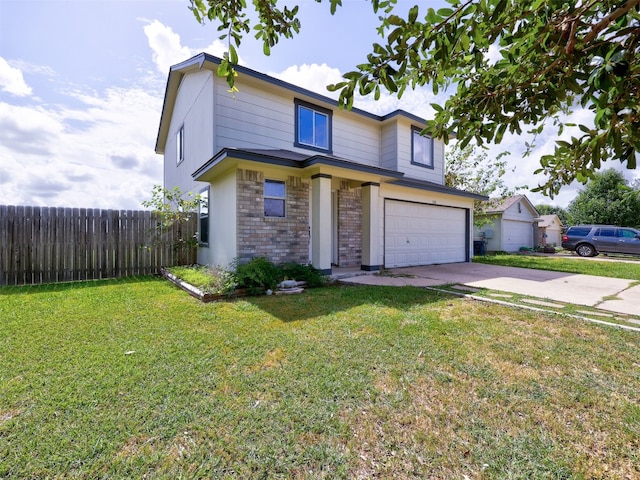 view of front property featuring a garage and a front yard