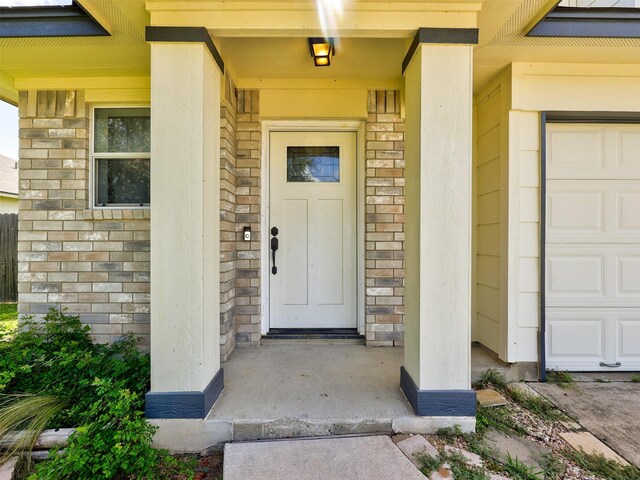 doorway to property featuring a garage