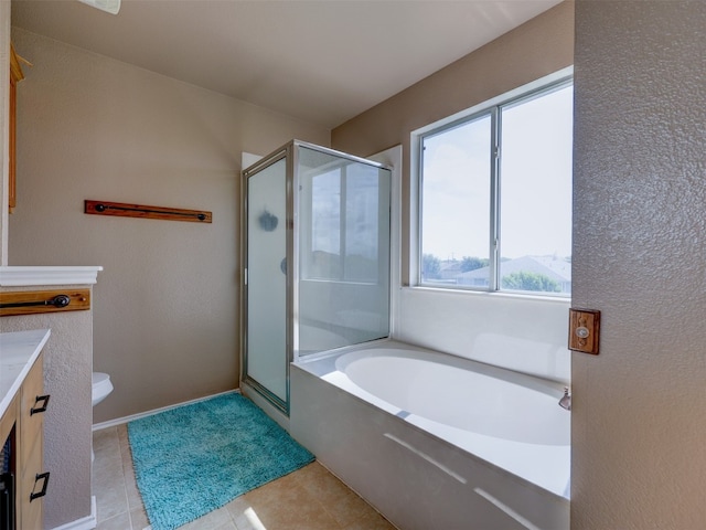 full bathroom featuring tile patterned flooring, separate shower and tub, vanity, and toilet