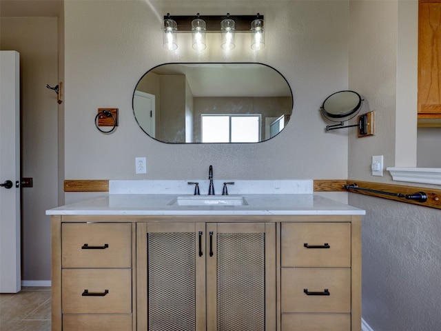 bathroom with tile patterned floors and vanity