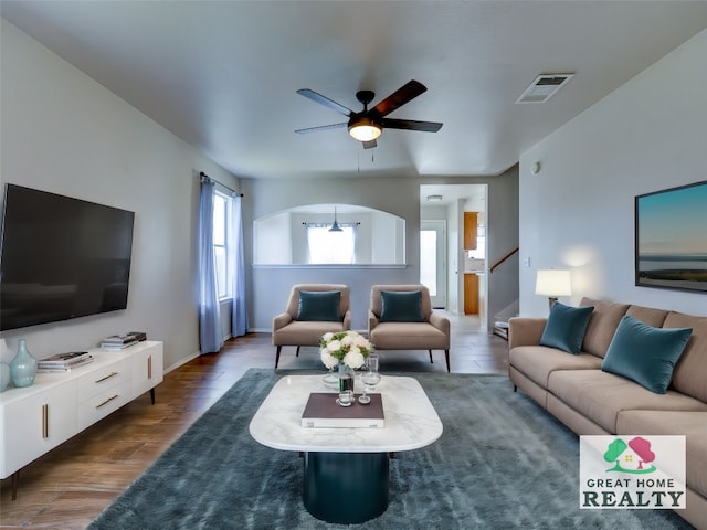 living room with hardwood / wood-style floors and ceiling fan