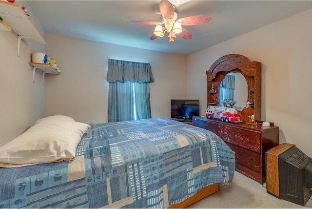 bedroom featuring light colored carpet and ceiling fan