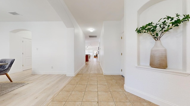 hallway with light wood-type flooring