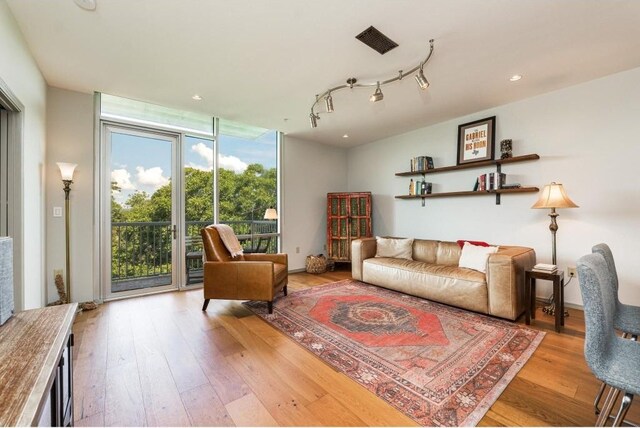 living room with light hardwood / wood-style flooring