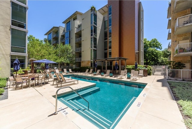 view of swimming pool featuring a patio area