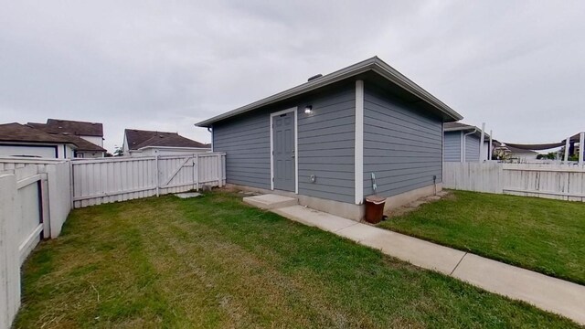 view of side of home featuring a yard