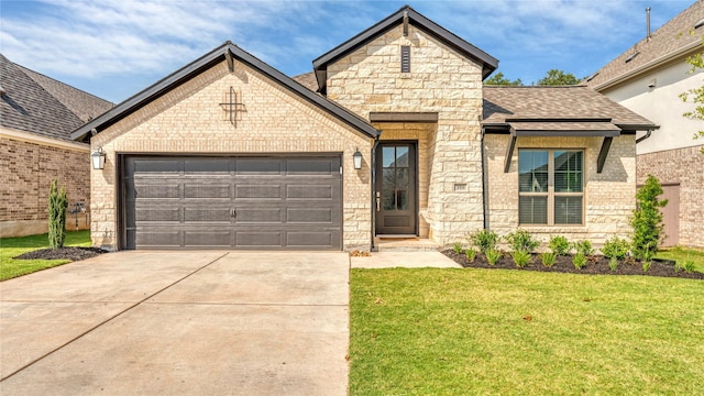 view of front of property featuring a garage and a front lawn