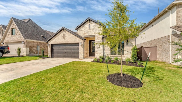 view of front of property with a garage and a front lawn