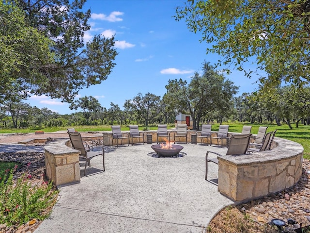 view of patio / terrace with an outdoor fire pit