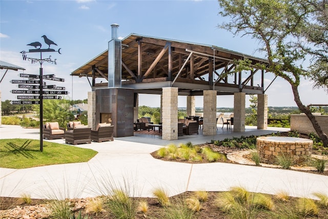 view of property's community with a gazebo, a patio area, and an outdoor hangout area