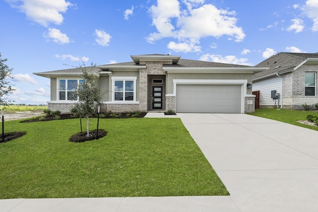 prairie-style home with a front lawn and a garage