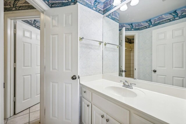 bathroom with tile patterned floors and vanity