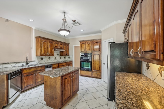 kitchen featuring light tile patterned flooring, a center island, black appliances, decorative backsplash, and sink