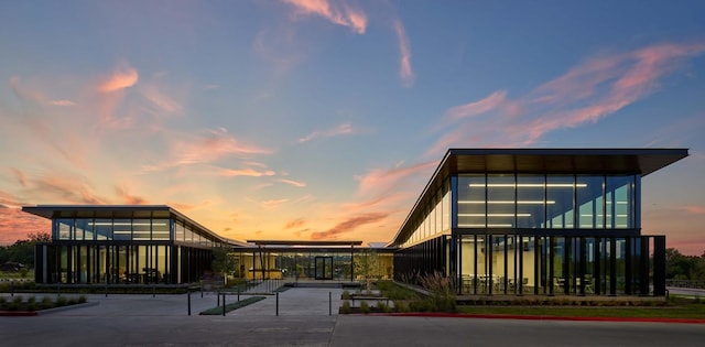 view of outdoor building at dusk