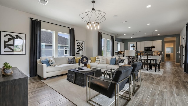 living room with an inviting chandelier