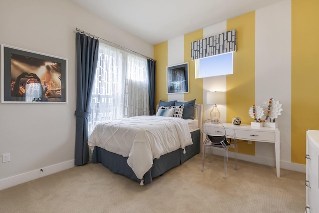 bedroom with light colored carpet