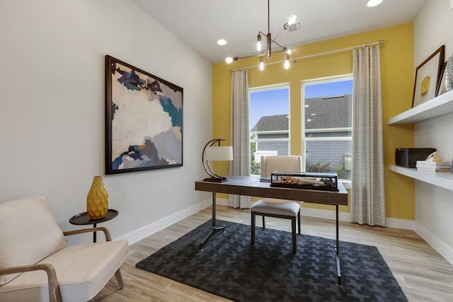 office area featuring light hardwood / wood-style flooring and a notable chandelier