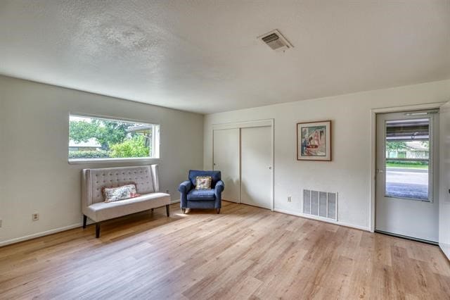 unfurnished room featuring light hardwood / wood-style floors