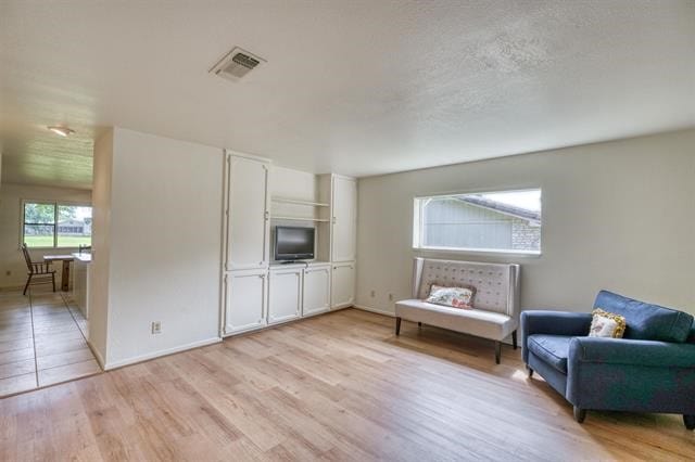 unfurnished room with light wood-type flooring