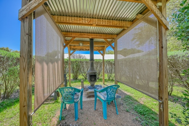 view of patio featuring an outbuilding and an outdoor fire pit