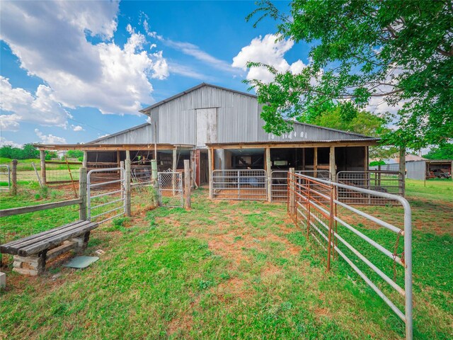 view of stable with an outbuilding