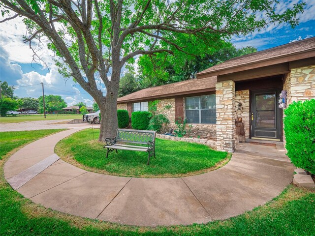 exterior space with a front yard