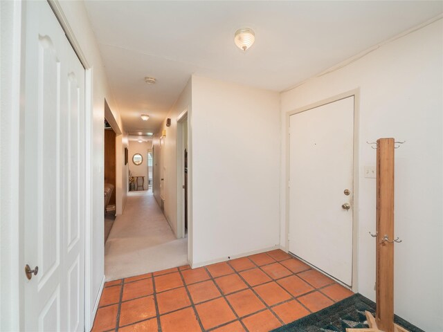 hallway with light tile patterned floors