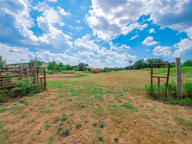 view of yard with a rural view