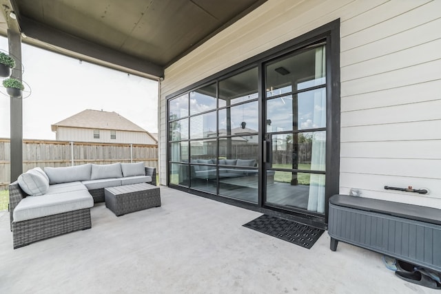 view of patio / terrace featuring an outdoor living space and radiator