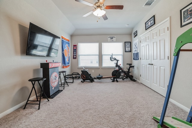 exercise room featuring carpet floors and ceiling fan