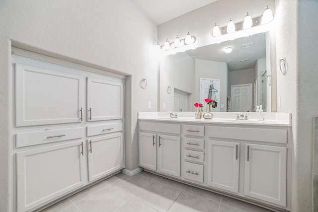 bathroom featuring dual vanity and tile patterned flooring