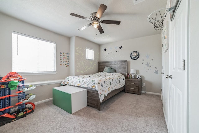 carpeted bedroom with ceiling fan