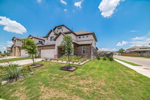 craftsman house with a garage and a front lawn