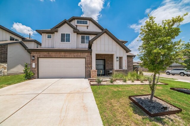 craftsman house with a garage and a front lawn