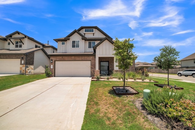 craftsman-style house featuring a garage and a front lawn