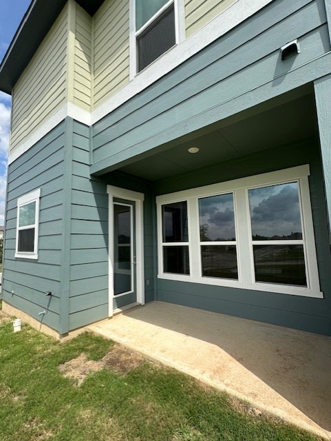 rear view of house with a patio area