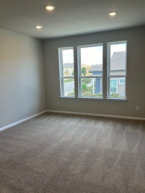 empty room featuring carpet floors