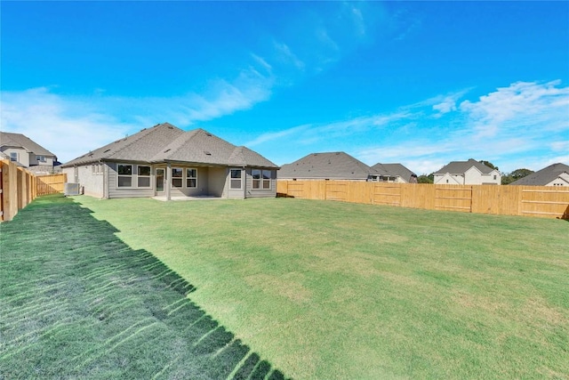 607 Breeze Hollow Ln, Georgetown, TX 78628 - back of property featuring a fenced backyard and a patio area