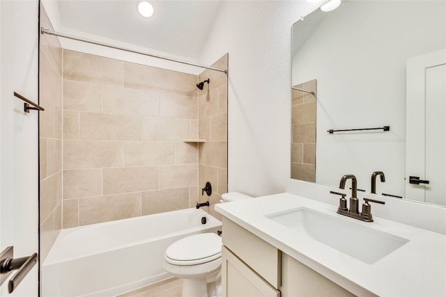 full bathroom featuring vanity, toilet, and tiled shower / bath