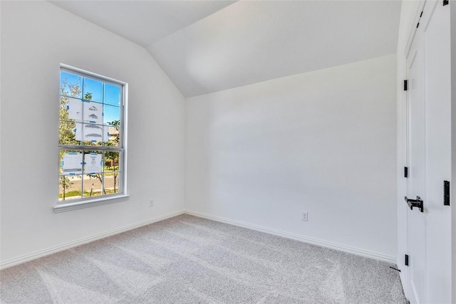 607 Breeze Hollow Ln, Georgetown, TX 78628 - carpeted empty room featuring vaulted ceiling and baseboards