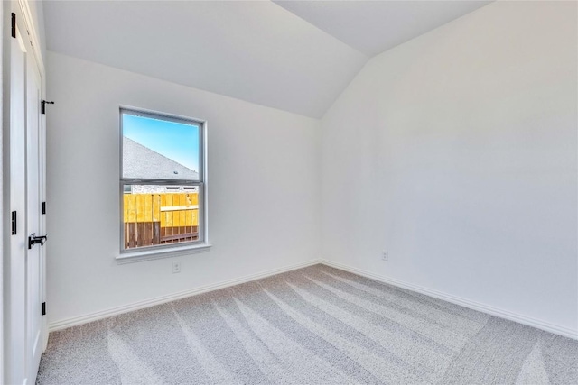 607 Breeze Hollow Ln, Georgetown, TX 78628 - spare room featuring carpet flooring and lofted ceiling