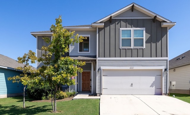 view of front of home featuring a garage and a front yard