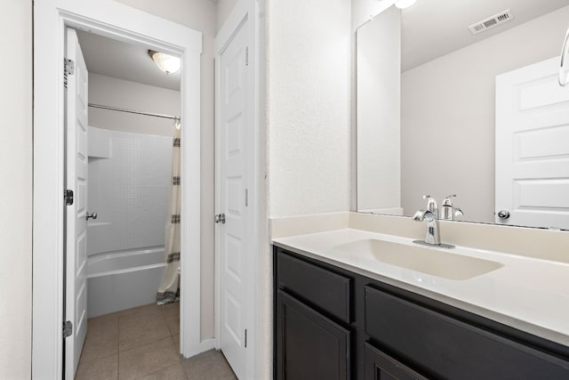 bathroom featuring vanity, tile patterned flooring, and shower / bathtub combination with curtain