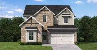 view of front facade with a front yard and a garage